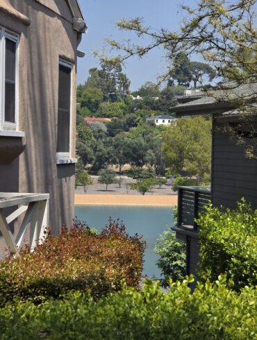 Silver Lake Reservoir framed by a modern dark wood fence