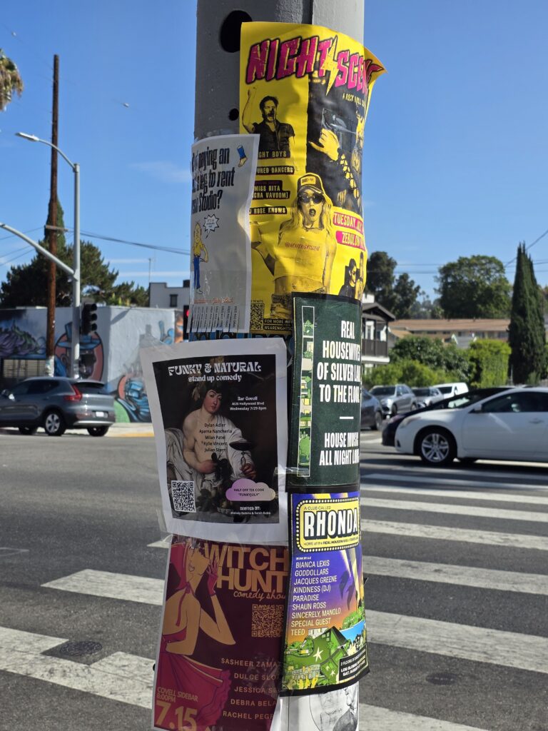 Silver Lake Blvd utility pole canvassed with wild fliers of events, and local things.