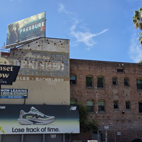 Outside Sunset Row Sign with an old brick building