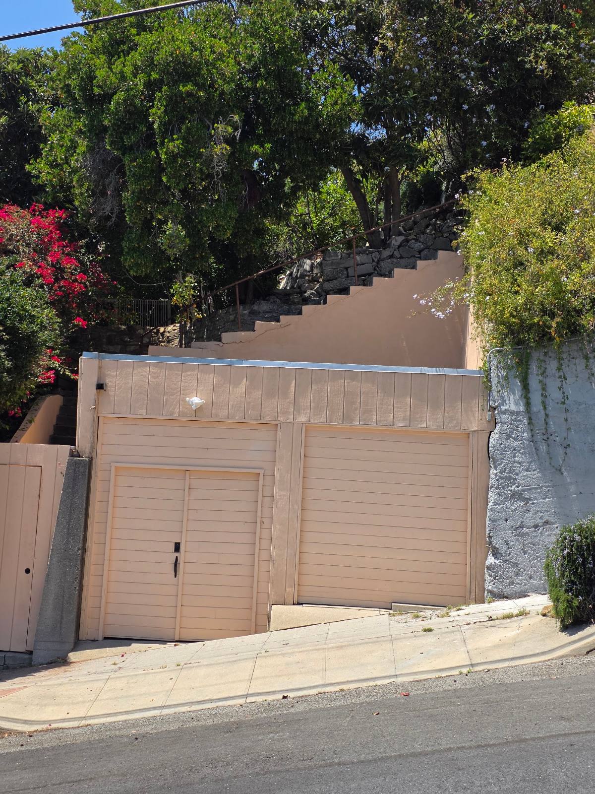 Hillside driveway, garage and stairs at a Silver Lake home in Los Angeles