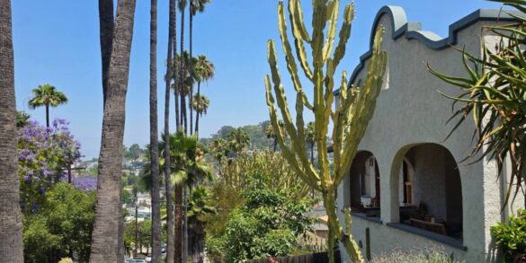Spanish style home with palm trees on a Silver Lake hillside street, Los Angeles